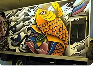 Koi fish artwork printed on a truck carriage door — vehicle UV printing Malaysia