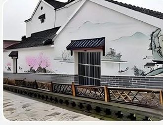 Ink-wash landscape mural printed on a house exterior wall — UV wall printing
